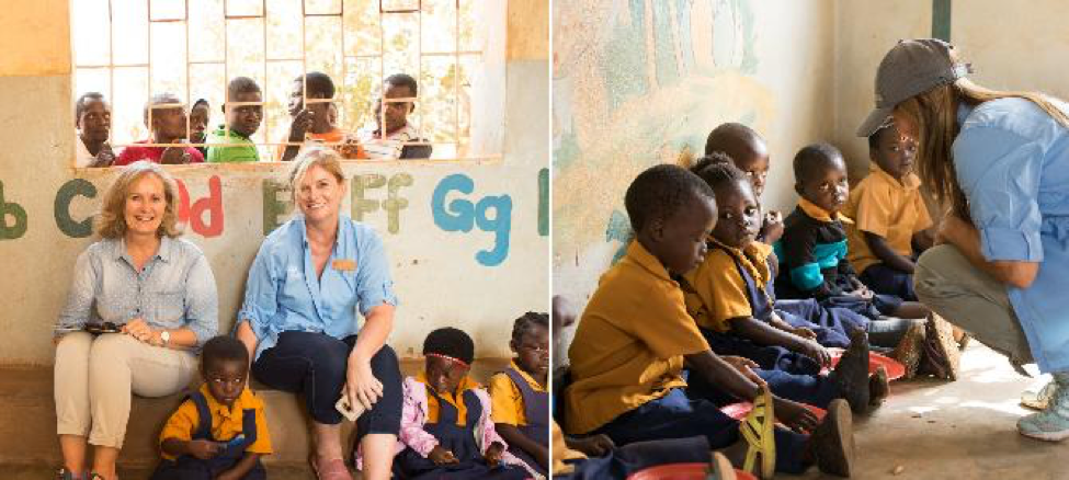 Nu Skin employees pose for a picture with children at a community-based child care center in Malawi.
